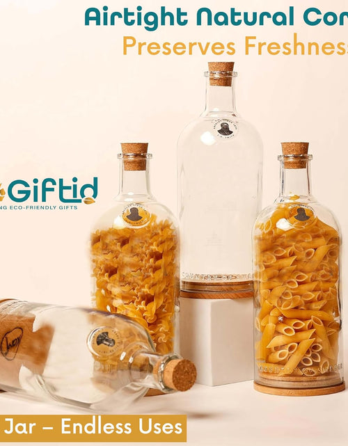 Load image into Gallery viewer, Upcycled Vodka Storage Jars Set of 2 – Handmade Glass Canisters
